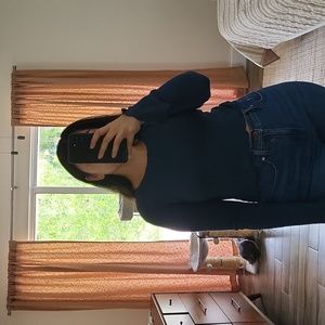 Cropped dark teal sweater with fluted wrists